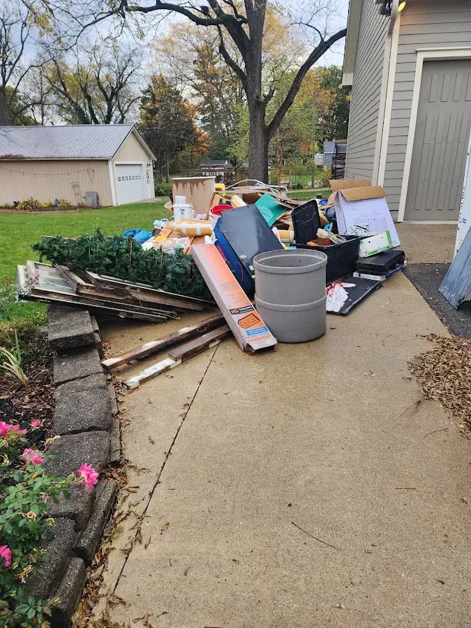 Dumpster being loaded with debris for 10 Yard Dumpster Rental in Homestead